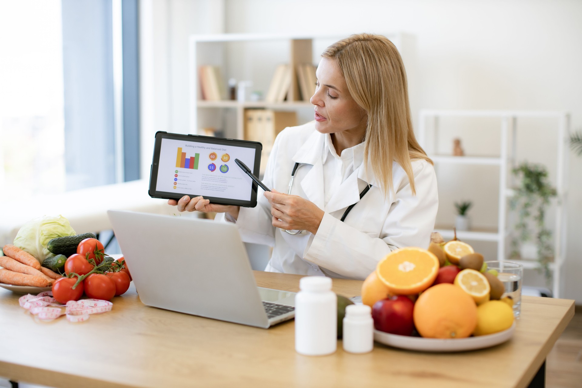 Confident lady in doctor's coat getting presentation on laptop.